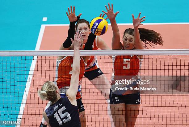 Femke Stoltenborg and Robin de Kruijf of Netherlands go for the block against Kimberly Hill of United States during the Women's Bronze Medal Match...