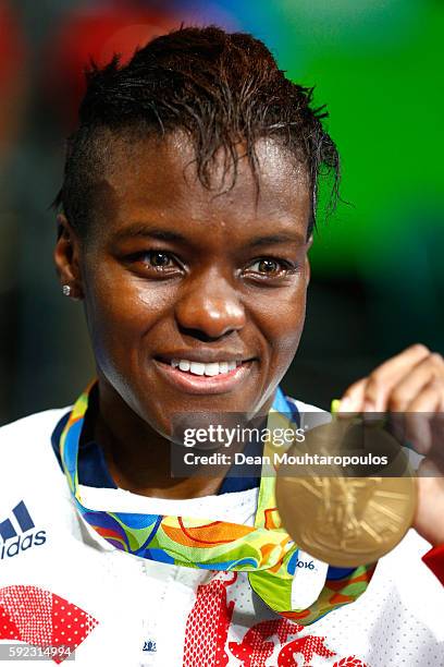 Gold medalist Nicola Adams of Great Britain poses during the medal ceremony for the Women's Fly on Day 15 of the Rio 2016 Olympic Games at Riocentro...