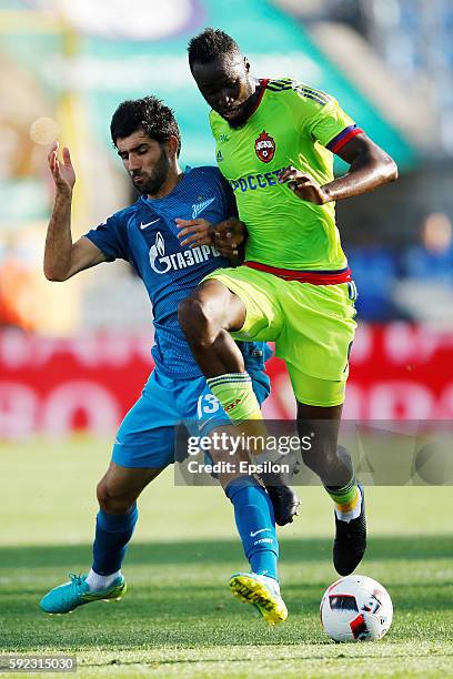 Luis Neto of FC Zenit St. Petersburg and Lacina Traore of PFC CSKA Moscow vie for the ball during the Russian Football League match between FC Zenit...