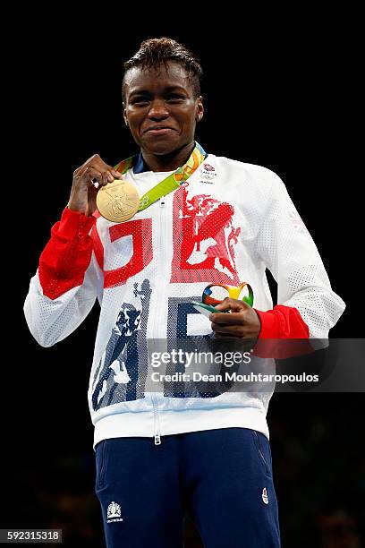 Gold medalist Nicola Adams of Great Britain poses during the medal ceremony for the Women's Fly on Day 15 of the Rio 2016 Olympic Games at Riocentro...