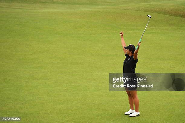 Lydia Ko of New Zealand reacts after putting for birdie on the 18th green to win silver during the Women's Golf Final on Day 15 of the Rio 2016...