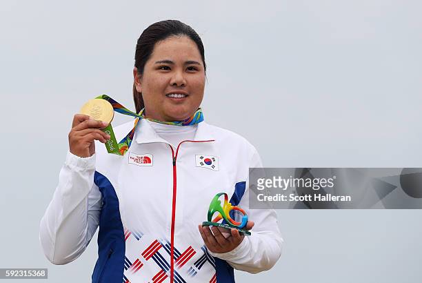 Gold medalist, Inbee Park of Korea poses on the podium during the medal ceremony for Women's Golf on Day 15 of the Rio 2016 Olympic Games at the...