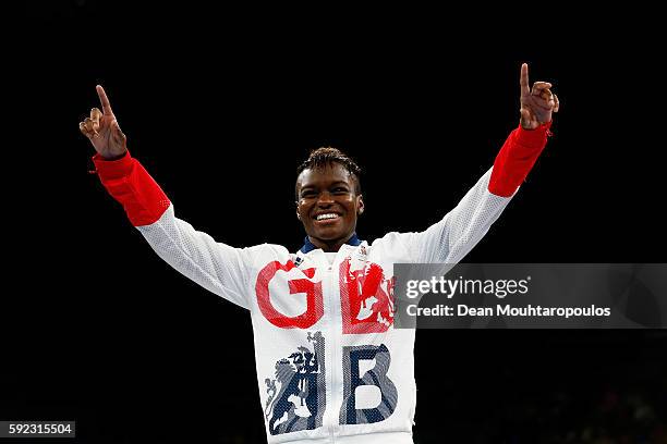 Gold medalist Nicola Adams of Great Britain poses during the medal ceremony for the Women's Fly on Day 15 of the Rio 2016 Olympic Games at Riocentro...