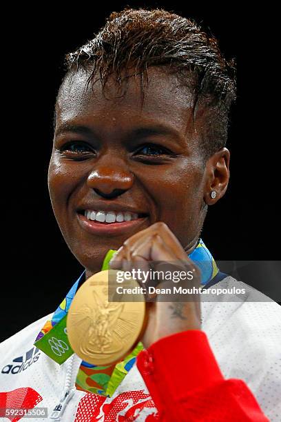 Gold medalist Nicola Adams of Great Britain poses during the medal ceremony for the Women's Fly on Day 15 of the Rio 2016 Olympic Games at Riocentro...