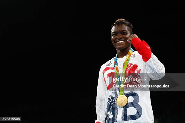 Gold medalist Nicola Adams of Great Britain poses during the medal ceremony for the Women's Fly on Day 15 of the Rio 2016 Olympic Games at Riocentro...