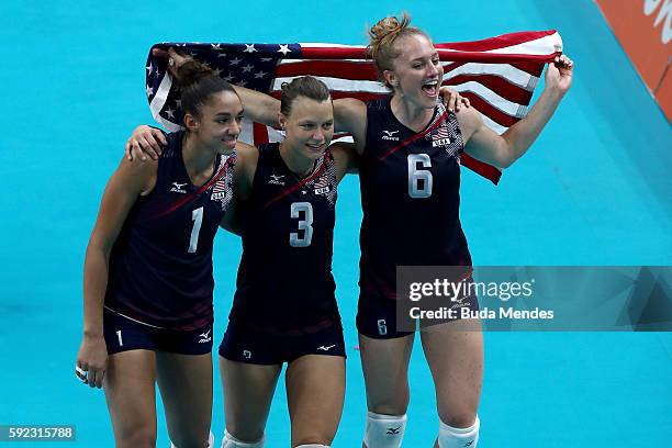 Alisha Glass, Courtney Thompson and Carli Lloyd of United States celebrate after winning match point during the Women's Bronze Medal Match between...