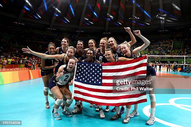 Team USA celebrates after winning the Women's Bronze Medal Match between Netherlands and the United States on Day 15 of the Rio 2016 Olympic Games at...