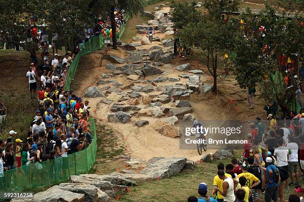 Perrine Clauzel of France races during the Women's Cross-Country Mountain Bike Race on Day 15 of the Rio 2016 Olympic Games at the Mountain Bike...