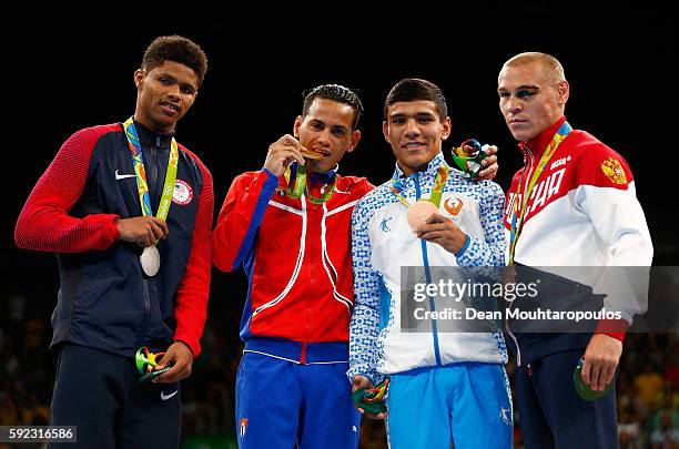 Silver medalist Shakur Stevenson of the United States, gold medalist Robeisy Ramirez of Cuba and bronze medalists Murodjon Akhmadaliev of Uzbekistan...