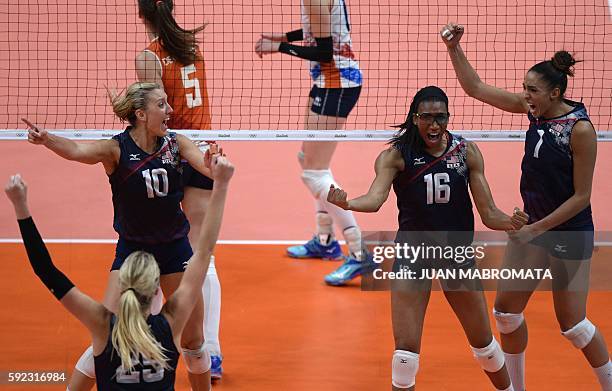S Jordan Larson-Burbach, USA's Foluke Akinradewo and USA's Alisha Glass celebrate after winning their women's bronze medal volleyball match against...