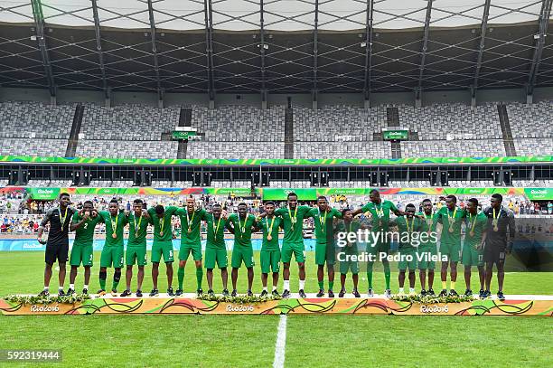 Nigeria players celebrate the bronze medal after the match between Nigeria and Honduras as part of Men`s Football - Olympics at Mineirao Stadium on...