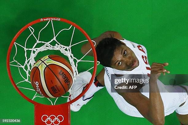 An overview shows USA's small forward Angel Mccoughtry watching the ball after scoring during a Women's Gold medal basketball match between USA and...