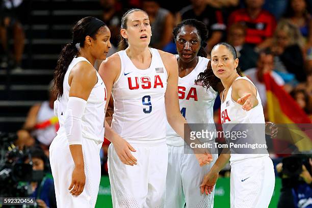 Maya Moore, Breanna Stewart, Tina Charles and Sue Bird of United States talk on the court during the Women's Gold Medal Game between United States...