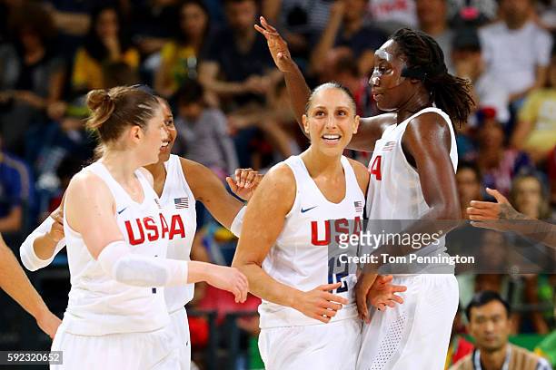 Lindsay Whalen, Diana Taurasi, Tina Charles of United States celebrate a play during the Women's Gold Medal Game between United States and Spain on...