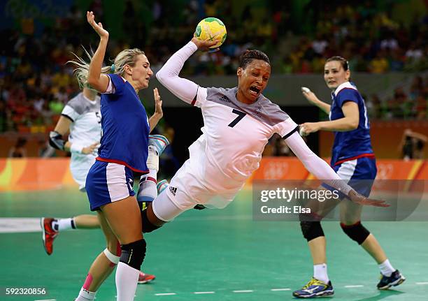 Allison Pineau of France takes a shot during the Women's Handball Gold medal match between France and Russia at Future Arena on Day 15 of the Rio...