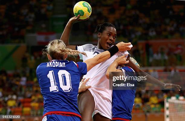 Gnonsiane Niombla of France is under pressure of Olga Akopian of Russia and Polina Kuznetsova of Russia during the Women's Handball Gold medal match...