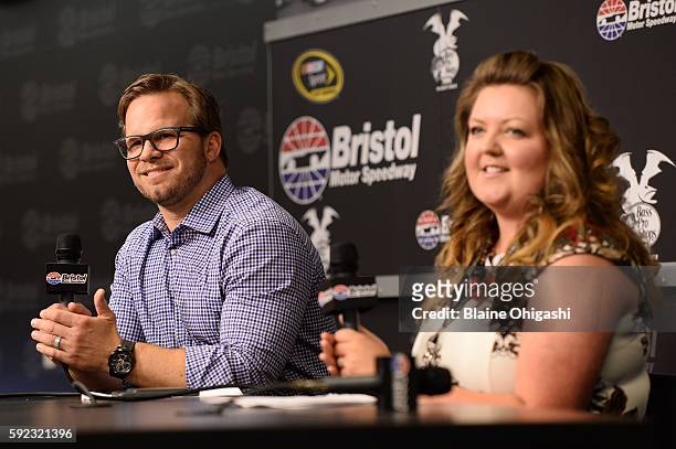 Marcus Smith, CEO of Speedway Motorsports, Inc., and Ashley Montanaro, Manager of Brand and Creative at Aspen Dental Management, Inc., speak in a...