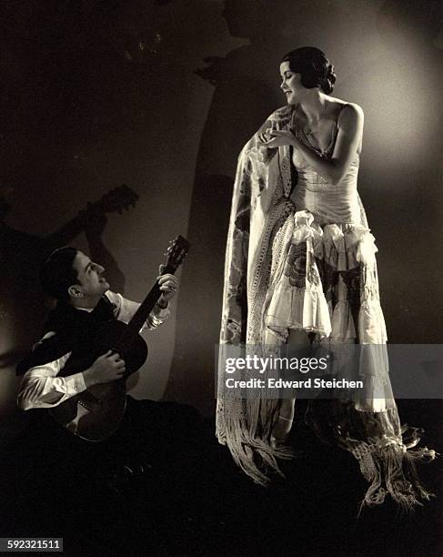 Argentine tango dancing pair, Rosita and Ramon, performing at the Casanova Club, with Ramon, kneeling at her knees, playing a guitar