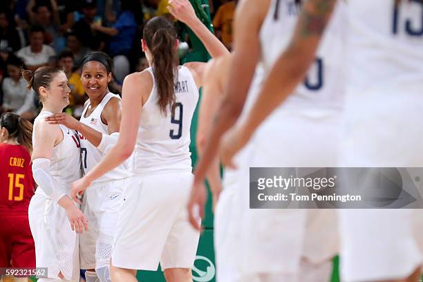 Lindsay Whalen, Maya Moore and Breanna Stewart of United States celebrate a play during the Women's Gold Medal Game between United States and Spain...