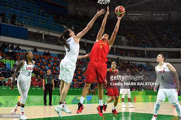 Spain's power forward Laura Nicholls and USA's power forward Breanna Stewart go for a rebound during a Women's Gold medal basketball match between...