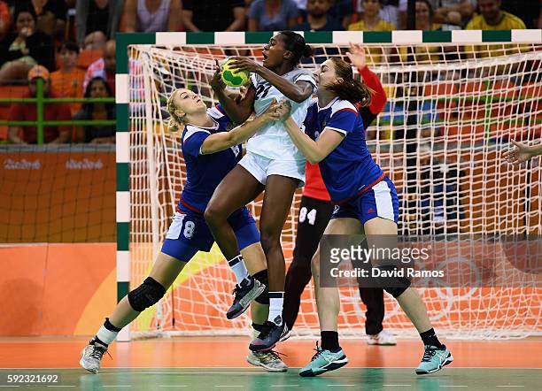 Estelle Nze-Minko of France under pressure of Anna Sen of Russia and Polina Kuznetsova of Russia during the Women's Handball Gold medal match between...