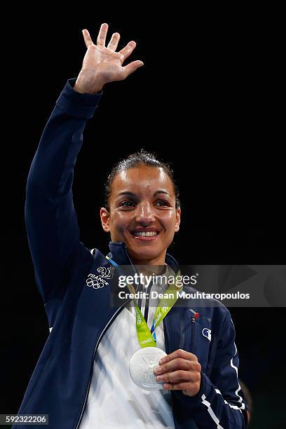 Silver medalist Sarah Ourahmoune of France poses during the medal ceremony for the Women's Fly on Day 15 of the Rio 2016 Olympic Games at Riocentro -...