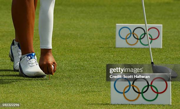 Mariajo Uribe of Colombia tees up her ball on the ninth hole during the Women's Golf Final on Day 15 of the Rio 2016 Olympic Games at the Olympic...