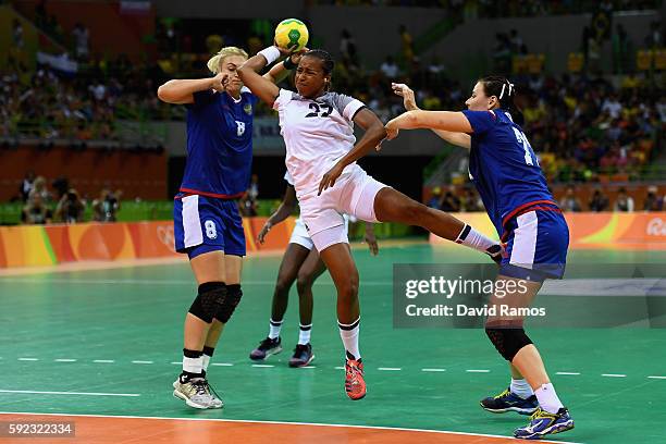 Estelle Nze-Minko of France takes a shot during the Women's Handball Gold medal match between France and Russia at Future Arena on Day 15 of the Rio...