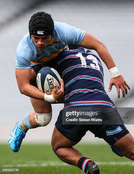 Paul Roache of Mount Albert Grammar is tackled during the Auckland Secondary Schools Final match between Mount Albert Grammar and Sacred Heart at...