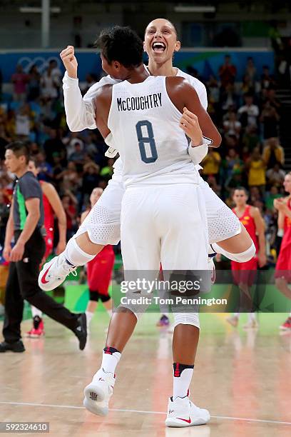 Angel Mccoughtry and Diana Taurasi of United States celebrate after winning the Women's Gold Medal Game between United States and Spain on Day 15 of...