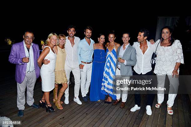 Guests pose in a group as Honoree Janna Bullock Hosts a Private Dinner Party to Raise Awareness for Hour Children Charity and their Upcoming Annual...
