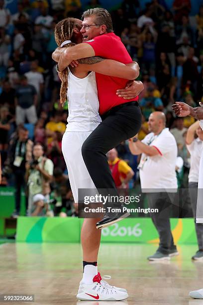 Brittney Griner and head coach Geno Auriemma of the United States celebrate winning the Women's Gold Medal Game between United States and Spain on...