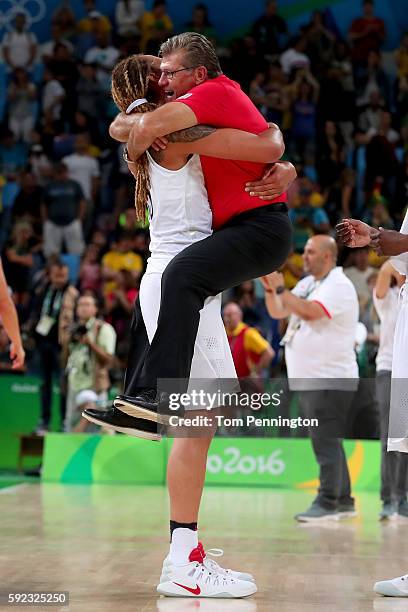 Brittney Griner and head coach Geno Auriemma of the United States celebrate winning the Women's Gold Medal Game between United States and Spain on...