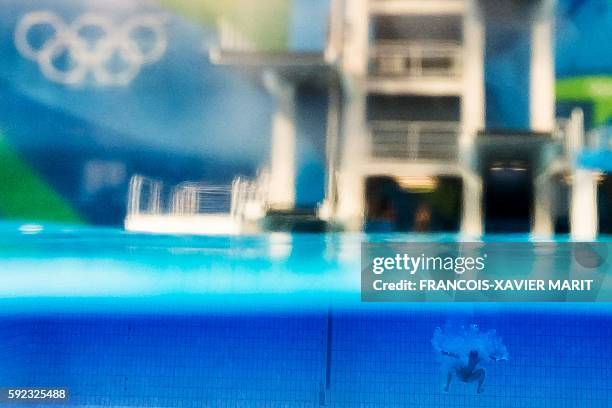 Picture taken with an underwater camera shows China's Chen Aisen competing in the Men's 10m Platform final during the diving event at the Rio 2016...