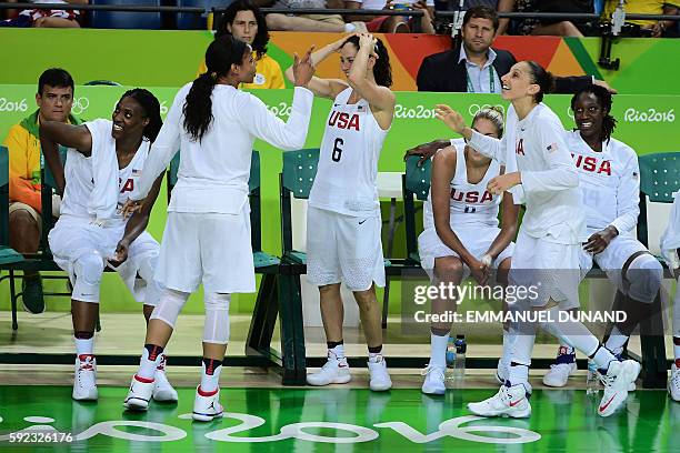 S forward Maya Moore jokes with USA's guard Sue Bird and USA's guard Diana Taurasi during a Women's Gold medal basketball match between USA and Spain...