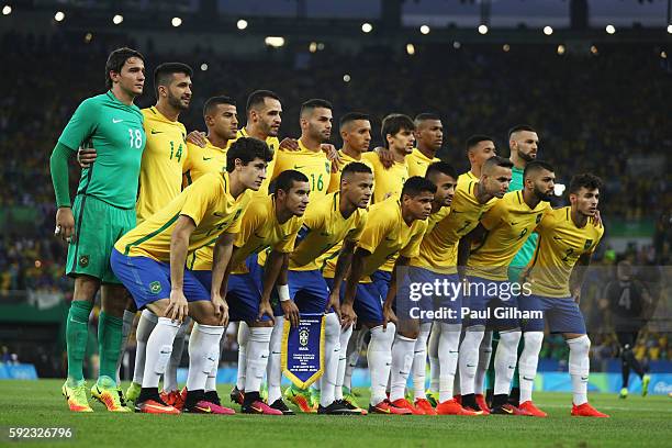 Brazil line up for their national anthem before the Men's Football Final between Brazil and Germany at the Maracana Stadium on Day 15 of the Rio 2016...