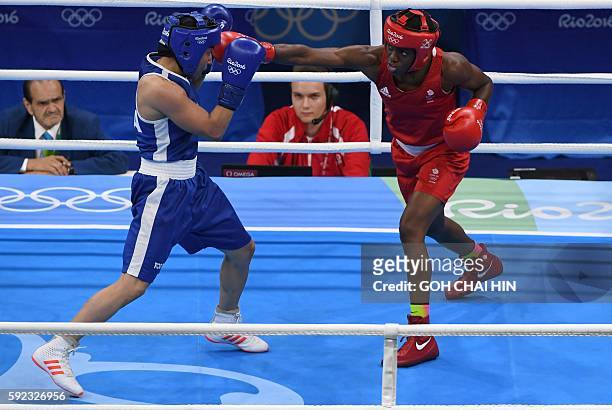 Great Britain's Nicola Adams fights France's Sarah Ourahmoune during the Women's Fly Final Bout at the Rio 2016 Olympic Games at the Riocentro -...