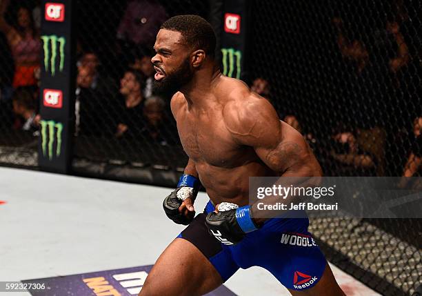 Tyron Woodley celebrates after knocking out Robbie Lawler in their welterweight championship bout during the UFC 201 event on July 30, 2016 at...