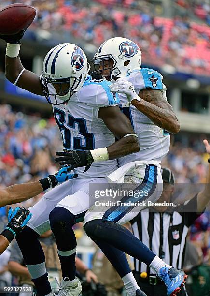 Andre Johnson of the Tennessee Titans congratulates teammate Harry Douglas on scoring a touchdown against the Carolina Panthers during the first half...