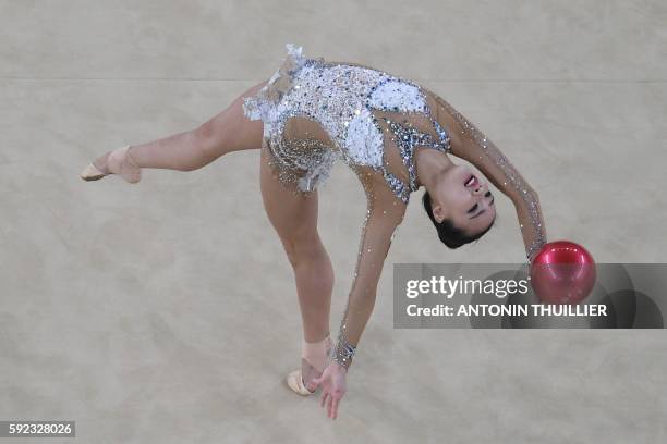 An overview shows South Korea's Son Yeon Jae competing in the individual all-around final event of the Rhythmic Gymnastics at the Olympic Arena...