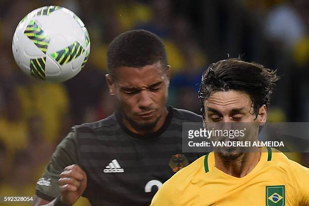 Germany's midfielder Jeremy Toljan vies with Brazil's defender Rodrigo Caio during the Rio 2016 Olympic Games men's football gold medal match between...