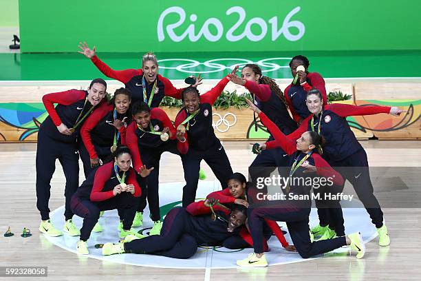 Gold medalists Team USA celebrate during the medal ceremony after the Women's Basketball competition on Day 15 of the Rio 2016 Olympic Games at...