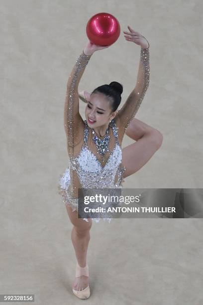 An overview shows South Korea's Son Yeon Jae competing in the individual all-around final event of the Rhythmic Gymnastics at the Olympic Arena...