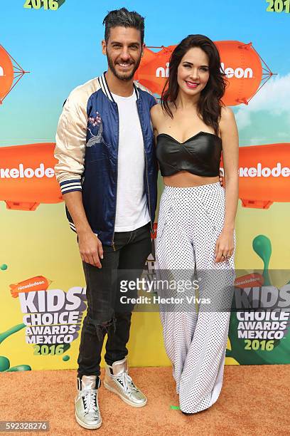 Erick Elias and Adriana Louvier pose during the Orange Carpet of the Kids Choice Awards 2016 at Auditorio Nacional on August 20, 2016 in Mexico City,...