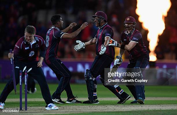 Northamptonshire batsmen Rory Kleinveldt and Rob Keogh celebrates with teammates after winning the NatWest t20 Blast Final between Northamptonshire...