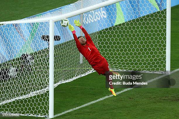 Timo Horn of Germany can't save a free kick from Neymar of Brazil to score the first Brazil goal during the Men's Football Final between Brazil and...