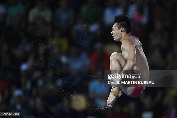 China's Chen Aisen competes in the Men's 10m Platform final during the diving event at the Rio 2016 Olympic Games at the Maria Lenk Aquatics Stadium...