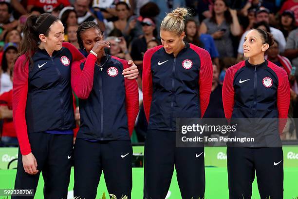 Gold medalists Breanna Stewart, Tamika Catchings, Elena Delle Donne and Diana Taurasi of United States celebrate during the medal ceremony after the...