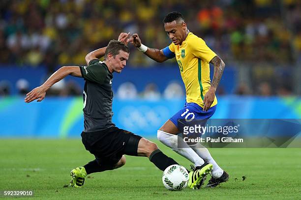 Lars Bender of Germany challenges Neymar of Brazil during the Men's Football Final between Brazil and Germany at the Maracana Stadium on Day 15 of...