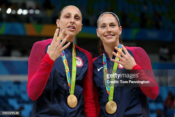 Gold medalists Diana Taurasi and Sue Bird of United States celebrate during the medal ceremony after the Women's Basketball competition on Day 15 of...